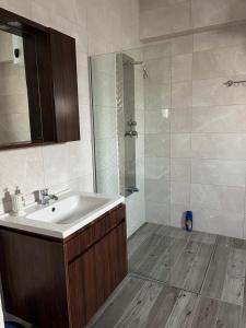 a bathroom with a sink and a shower at Tiana Boutique in Mağusa