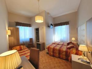 Postel nebo postele na pokoji v ubytování Hotel Continentale