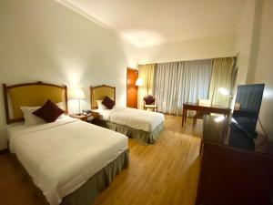 TV a/nebo společenská místnost v ubytování Oriental Crystal Hotel