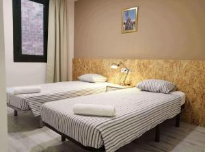 Posteľ alebo postele v izbe v ubytovaní Diagonal Apartments