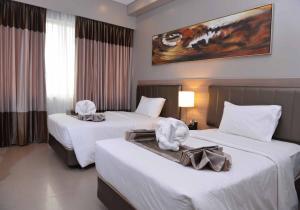 Voodi või voodid majutusasutuse Bayfront Hotel Cebu North Reclamation toas
