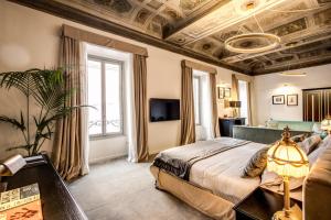Postel nebo postele na pokoji v ubytování Martius Private Suites Hotel