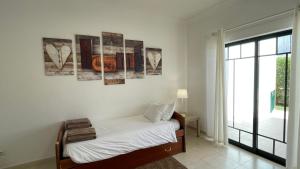 Ένα ή περισσότερα κρεβάτια σε δωμάτιο στο Noly by Check-in Portugal +28 φωτογραφίες