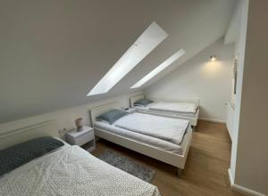Posteľ alebo postele v izbe v ubytovaní Apartmani Nova