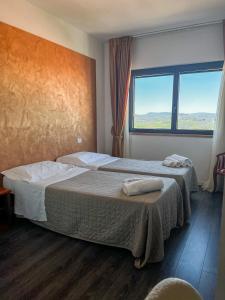 Postel nebo postele na pokoji v ubytování Hotel Joli