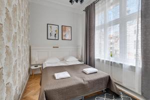 Posteľ alebo postele v izbe v ubytovaní Atelier Apartment Centrum by Grand Apartments