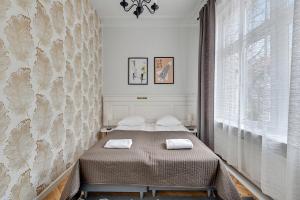Posteľ alebo postele v izbe v ubytovaní Atelier Apartment Centrum by Grand Apartments
