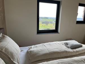 Een bed of bedden in een kamer bij De Hoogstam