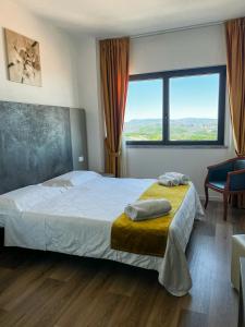 Postel nebo postele na pokoji v ubytování Hotel Joli