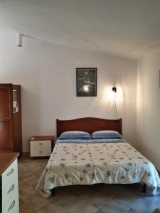 a bedroom with a bed in a room at Agriturismo Il Cipresso in Vada