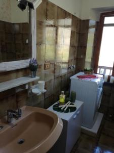 a bathroom with a sink and a tub and a sink at Fiordiluna near 5 terre in Beverino