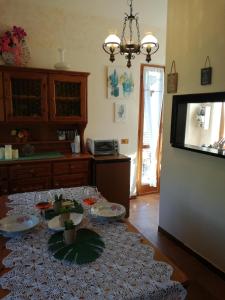 a kitchen with a table with wine glasses on it at Fiordiluna near 5 terre in Beverino