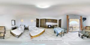 Postel nebo postele na pokoji v ubytování Hotel Zeus