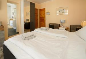 Postel nebo postele na pokoji v ubytování Hotel Zur Mühle