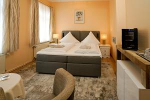 Postel nebo postele na pokoji v ubytování Hotel Zur Mühle