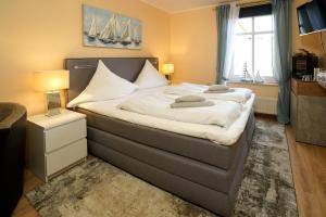 Postel nebo postele na pokoji v ubytování Hotel Zur Mühle