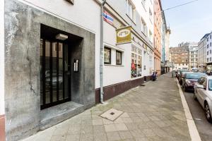 a building with a door open on a city street at Centerapartments Marienstrasse in Düsseldorf