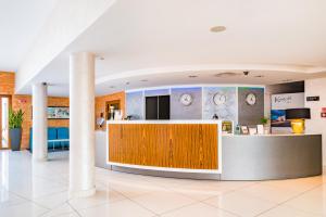 a lobby with a reception desk in a building at Hotel Kristoff in Łaszków
