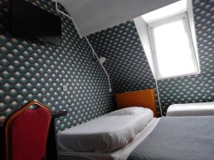 Postel nebo postele na pokoji v ubytování Hotel Central Anzac