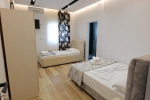 Postel nebo postele na pokoji v ubytování Blue Bay Hotel
