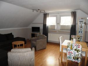 Posezení v ubytování Ferienwohnung Strandläufer + 4 fotografie