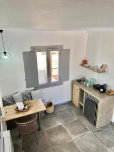 A kitchen or kitchenette at Aeron Suites