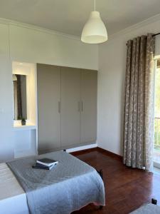 Ένα ή περισσότερα κρεβάτια σε δωμάτιο στο Ilias Apartments Dassia By Hotelius