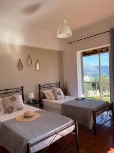 Ένα ή περισσότερα κρεβάτια σε δωμάτιο στο Ilias Apartments Dassia By Hotelius