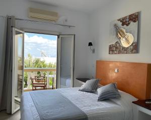 Postel nebo postele na pokoji v ubytování Danae Villa