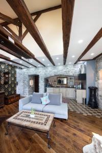 a living room with a couch and a table at Kazerma Apartment in Perast