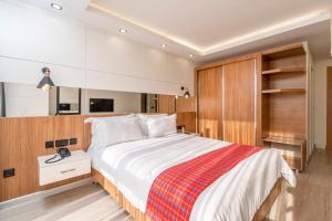 Voodi või voodid majutusasutuse MAA Hotel and Suites - Hurlingham, Nairobi toas