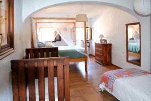 a bedroom with a bed and a mirror at 3 bedrooms house with private pool enclosed garden and wifi at El Soto in El Cañal