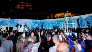 a crowd of people standing in front of a performance at Sunrise Resort Hotel in Kizilagac +99 photos