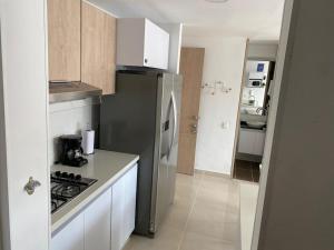 Kuchyň nebo kuchyňský kout v ubytování Hermoso conjunto residencial con piscina!
