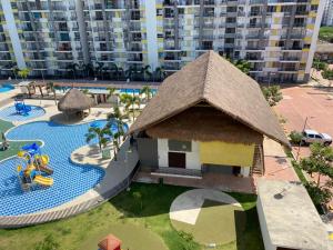 Výhľad na bazén v ubytovaní Hermoso conjunto residencial con piscina! alebo v jeho blízkosti
