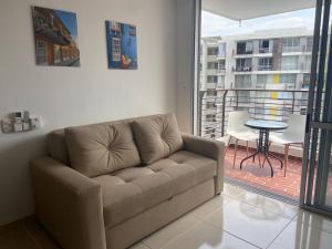 Posezení v ubytování Hermoso conjunto residencial con piscina!