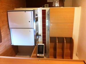 a model of a kitchen with a refrigerator at Be Myhôtel in Évreux