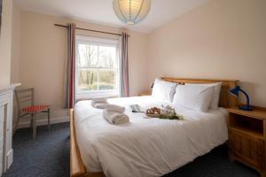 Posteľ alebo postele v izbe v ubytovaní Mere Cottage - Aldeburgh Coastal Cottages