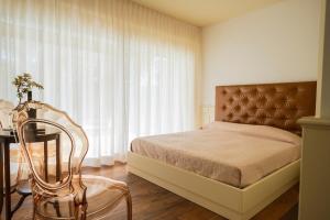 Luxury B&B La Riserva Dannunziana客房内的一张或多张床位