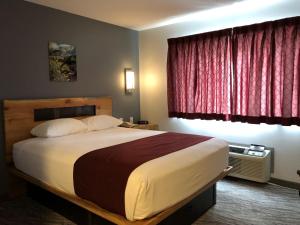Postel nebo postele na pokoji v ubytování First Gold Gaming Resort