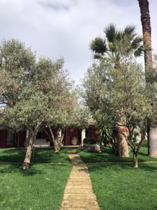a path in front of a house with trees at Residence Sa Pintadera in Càbras