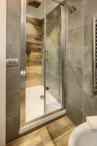 a shower with a glass door in a bathroom at L'obelisque maison de luxe in Rome +76 photos