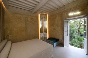 Postel nebo postele na pokoji v ubytování SUGAR ROOMS Residenza d'Epoca