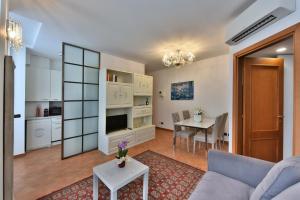 a living room with a couch and a table at PONTACCIO22 APARTMENT- BRERA CENTRO STORICO in Milan