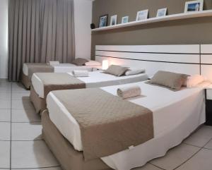 A bed or beds in a room at Hotel Marlen