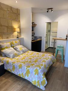 Ένα ή περισσότερα κρεβάτια σε δωμάτιο στο Les Suites de La Villa Mouneyra