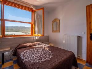 Postel nebo postele na pokoji v ubytování Casa Poniente - Casa Rural Los Cuatro Vientos