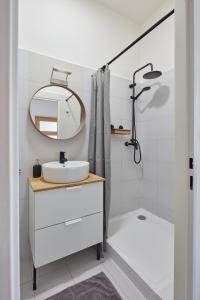 a bathroom with a sink and a mirror at Renovated Flat in Old Town Square by Prague Days in Prague