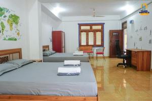 Postel nebo postele na pokoji v ubytování Yaarl Hostels