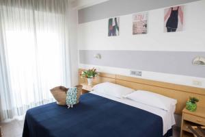 Ένα ή περισσότερα κρεβάτια σε δωμάτιο στο Hotel Villa Lina